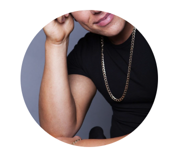 Man in black t-shirt and gold chain.