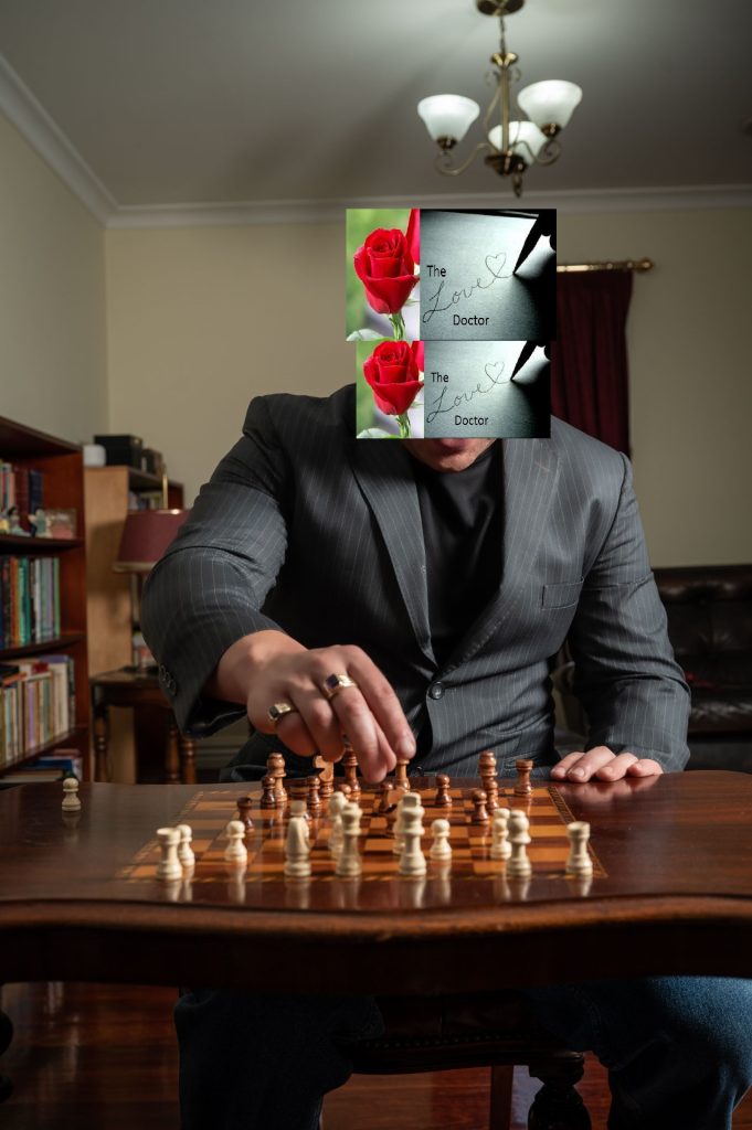 Man in suit plays chess, with 