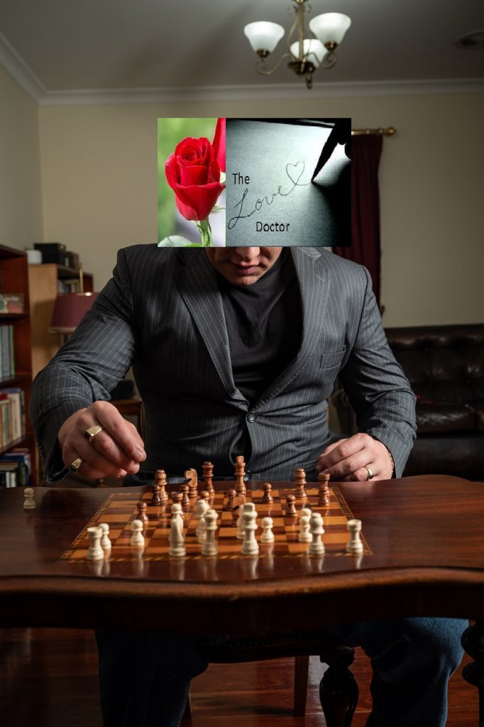 Man in suit plays chess, with rose and 