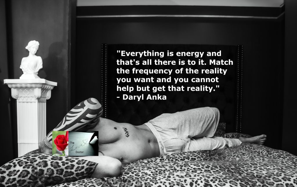 Black and white photo of a man on a bed with a quote about energy and reality.