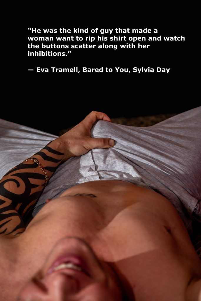 Man with tattoos and open shirt, quote about desire