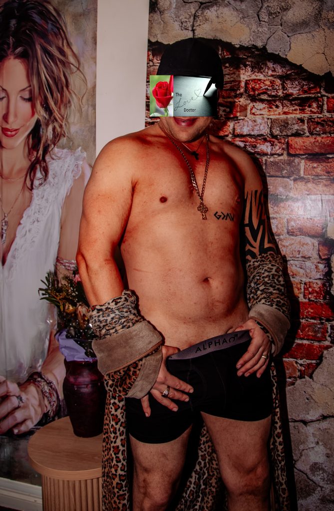 Man in boxer briefs and leopard print robe, with 