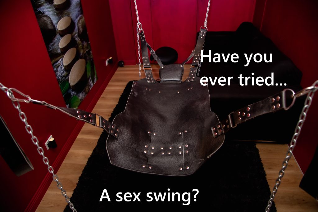 Leather sex swing hanging in a bedroom, text asks 