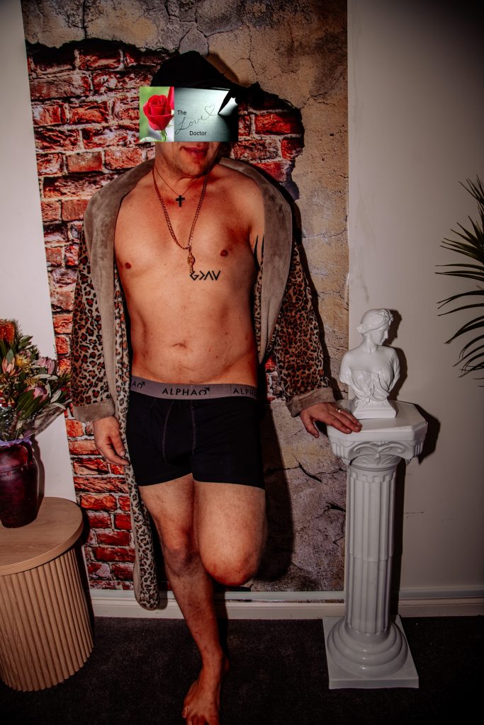 Man in leopard robe and boxers, tattoo, statue, July 2026 gallery