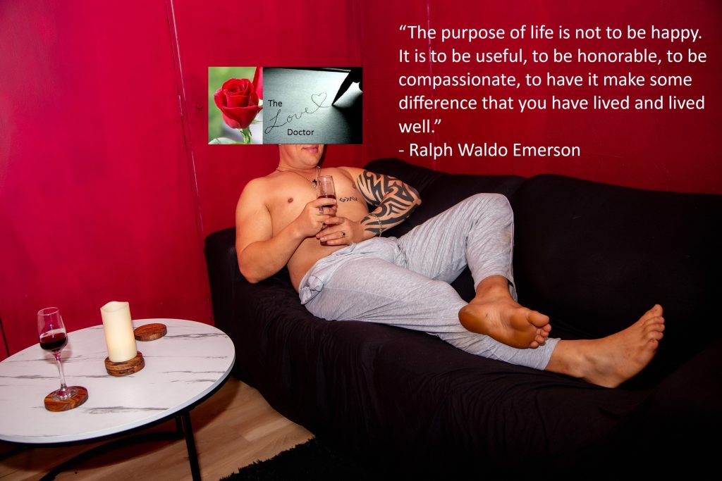 Man relaxing on couch, holding wine glass, with quote about life's purpose.