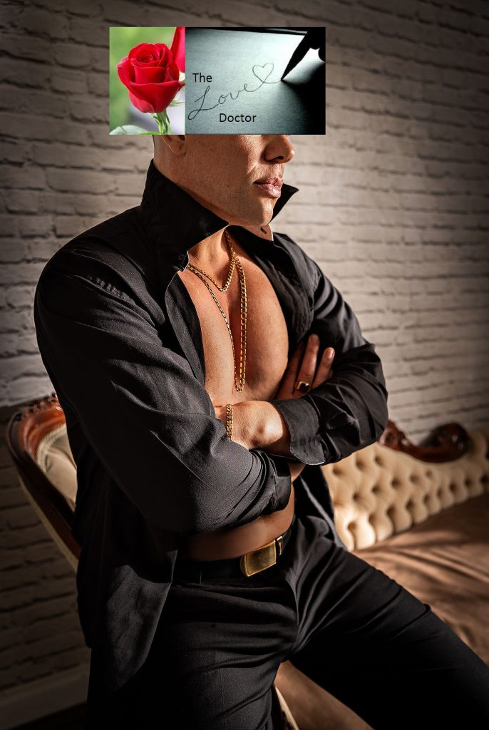 Man in black shirt with gold chains, rose, and 